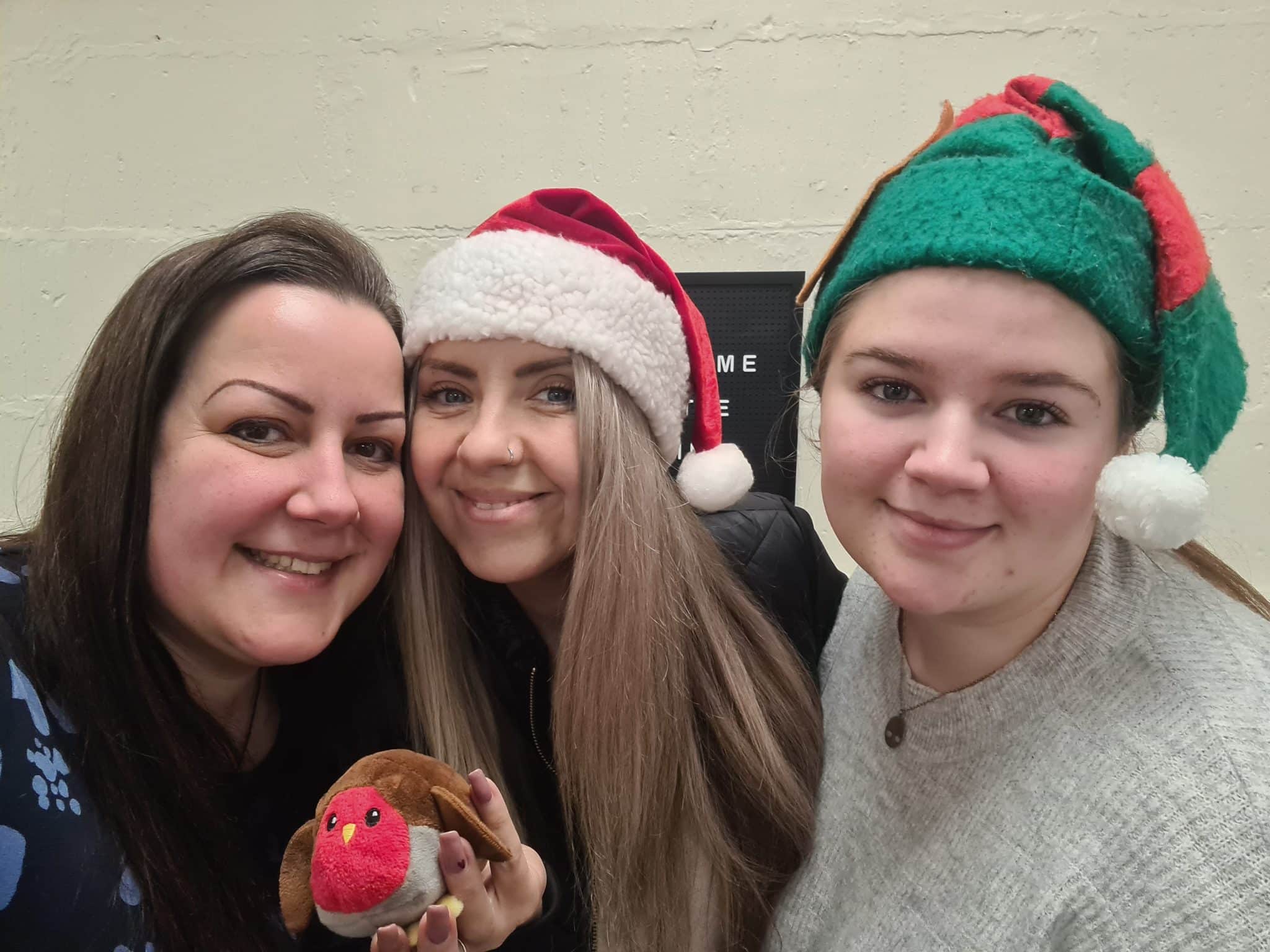 Recruitment Robin team members, Selina Rudzik, Sarah Allen, and Millie Quick, in festive Christmas attire